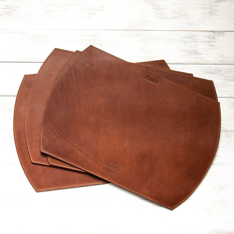 Straight edged oval personalized fine leather placemat in rich brown color.