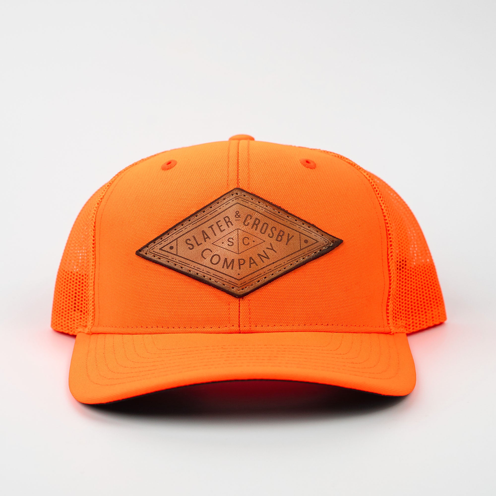 Neon orange Richardson 882 trucker hat with customized leather patch from Holtz Leather Co in Huntsville, Alabama