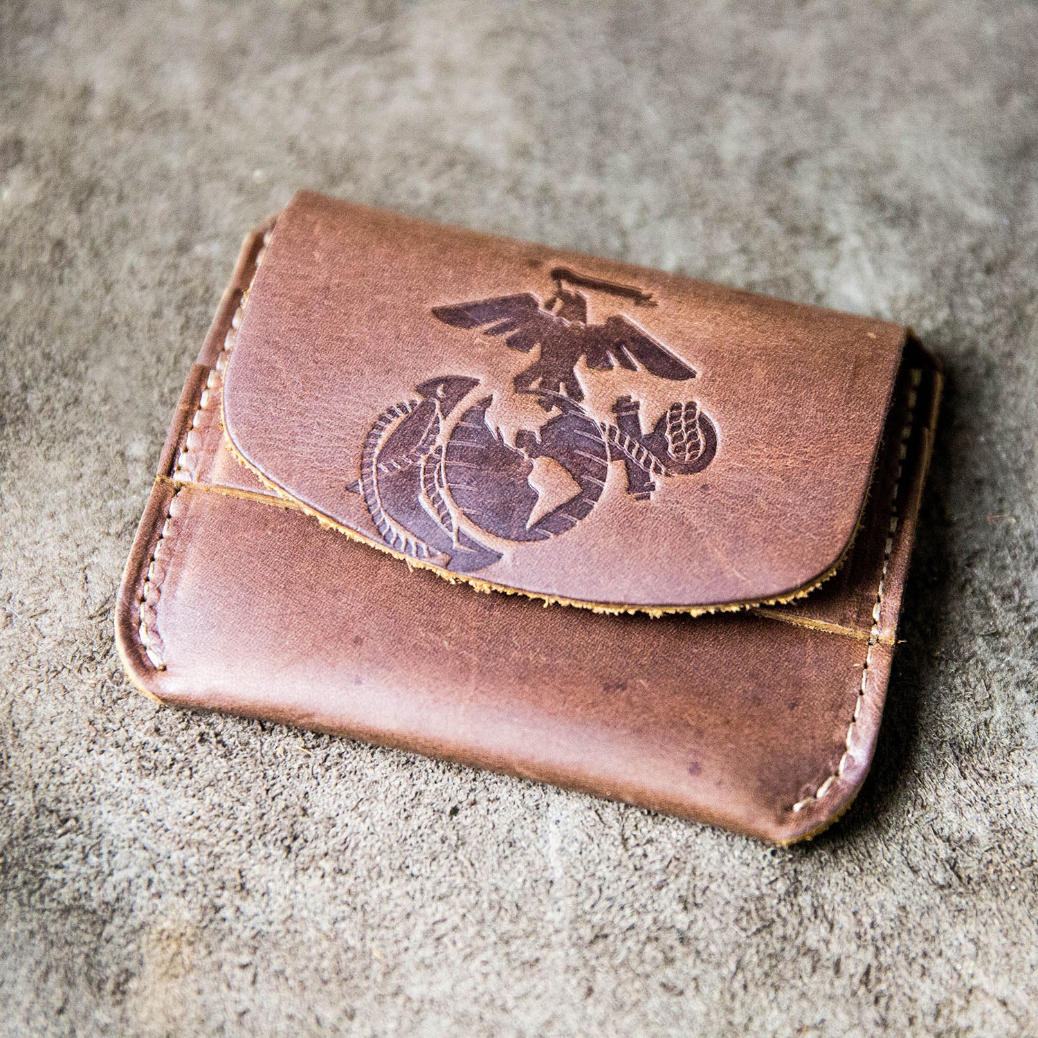 Fine leather front pocket wallet with flap closure and Marine Corps logo