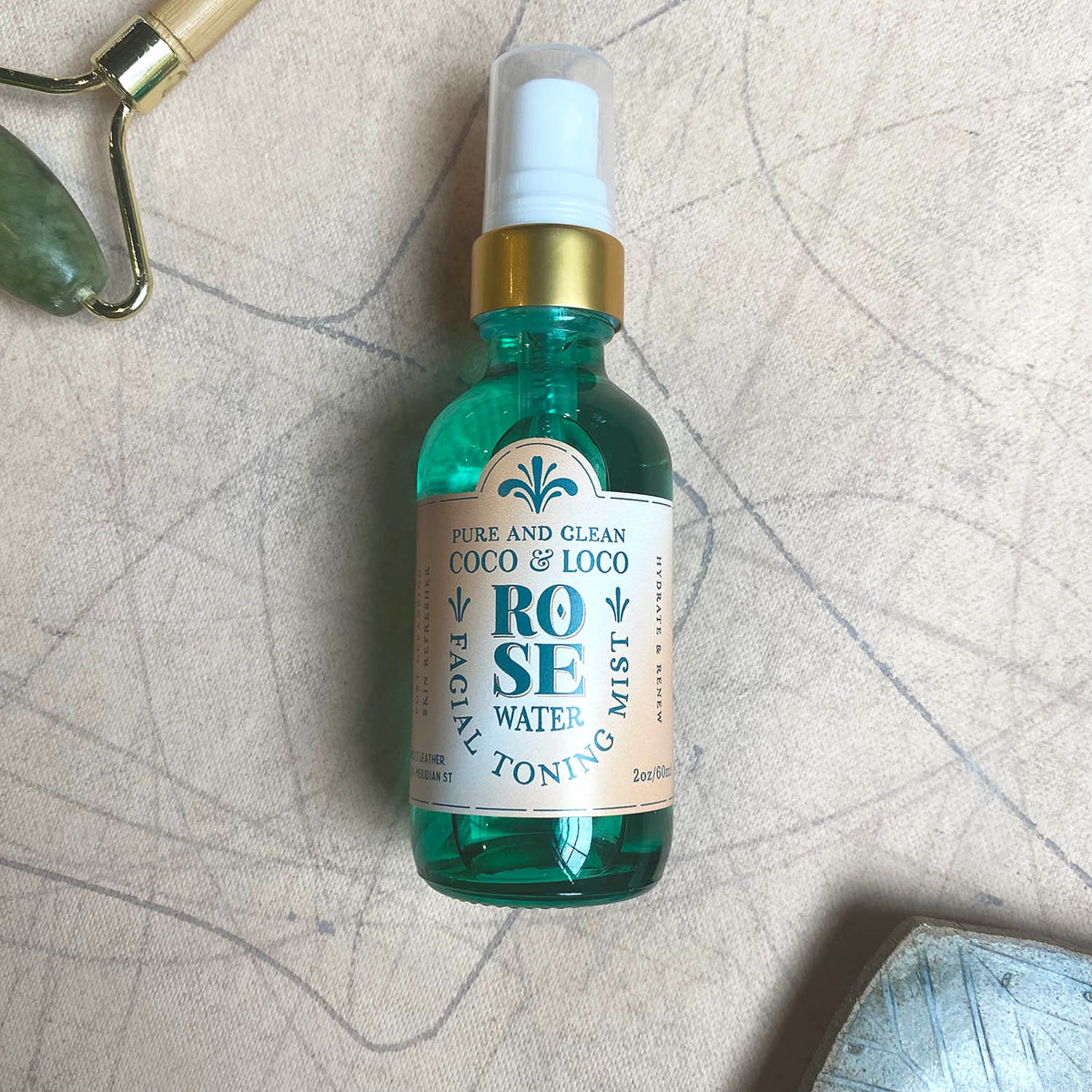 Rose water facial toning mist by Coco &amp; Loco in a green misting spray bottle from Holtz Leather Co in Huntsville, Alabama