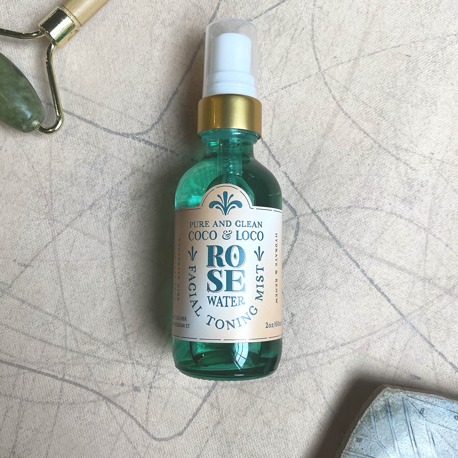 Rose water facial toning mist by Coco & Loco in a green misting spray bottle from Holtz Leather Co in Huntsville, Alabama