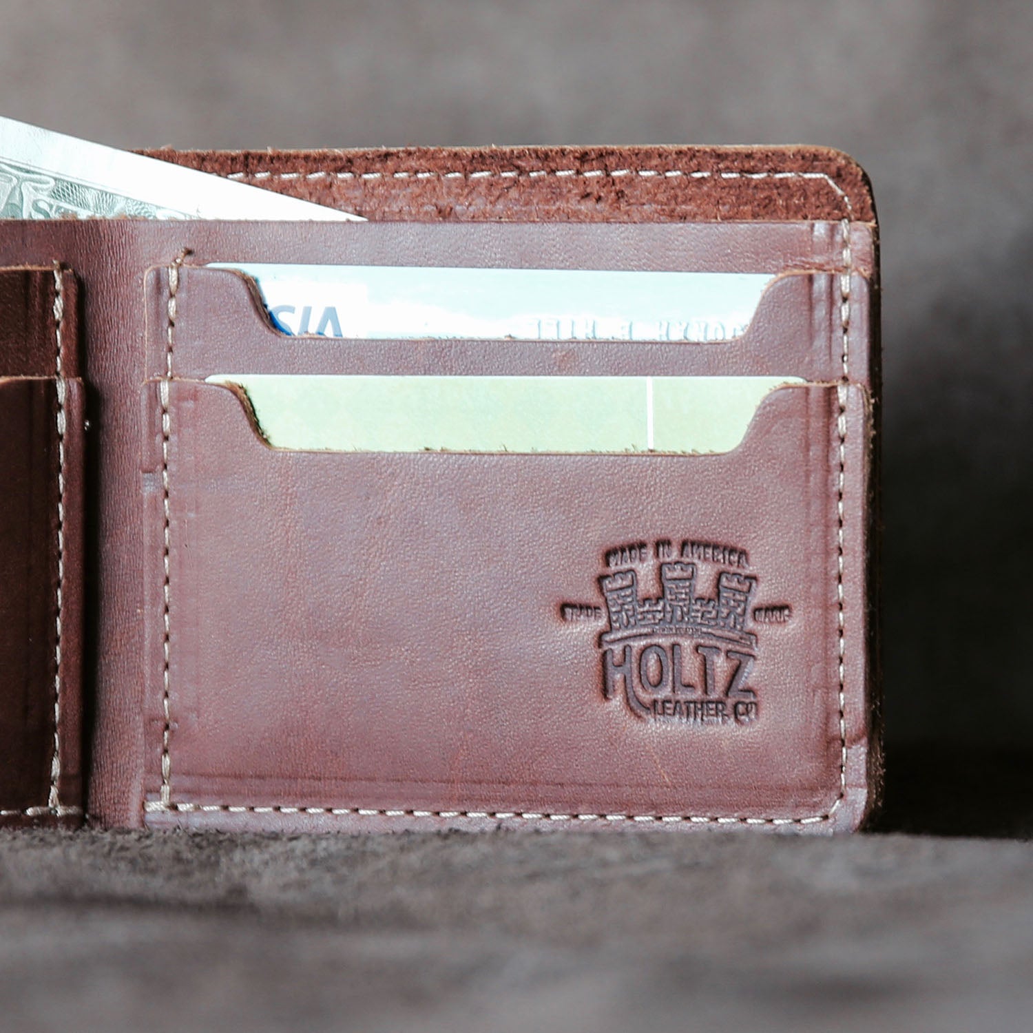 Fine leather bifold wallet with personalized initials and Marine Corps logo at Holtz Leather Co in Huntsville, Alabama