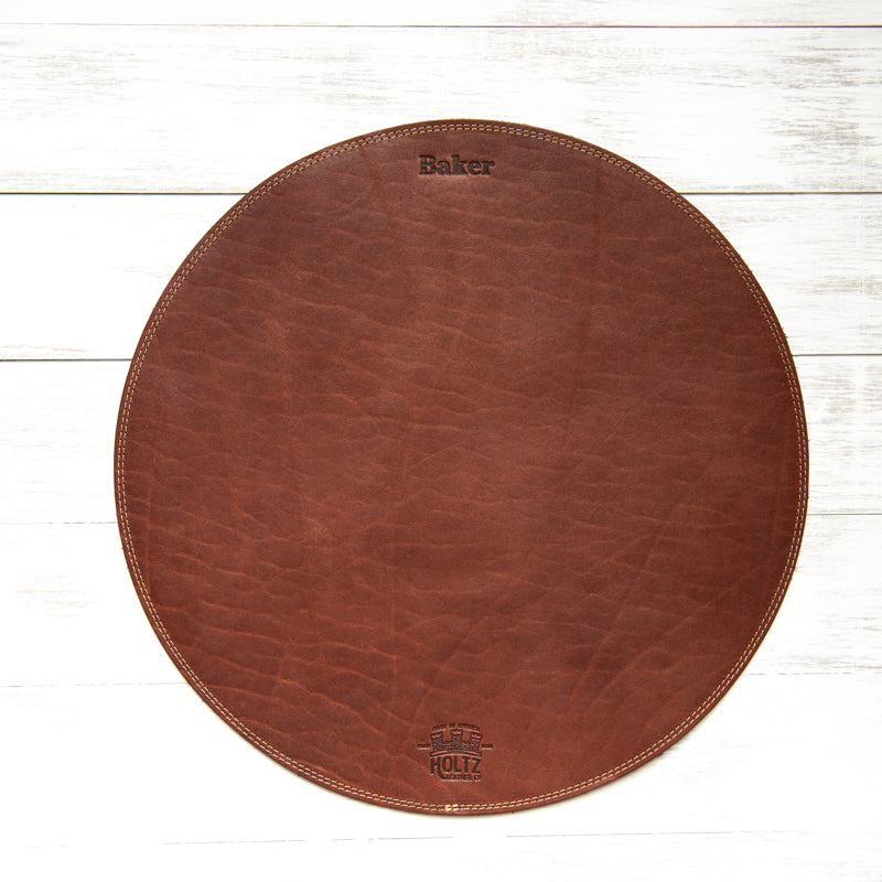 Fine leather round placemat with personalized named and Holtz Leather Co logo