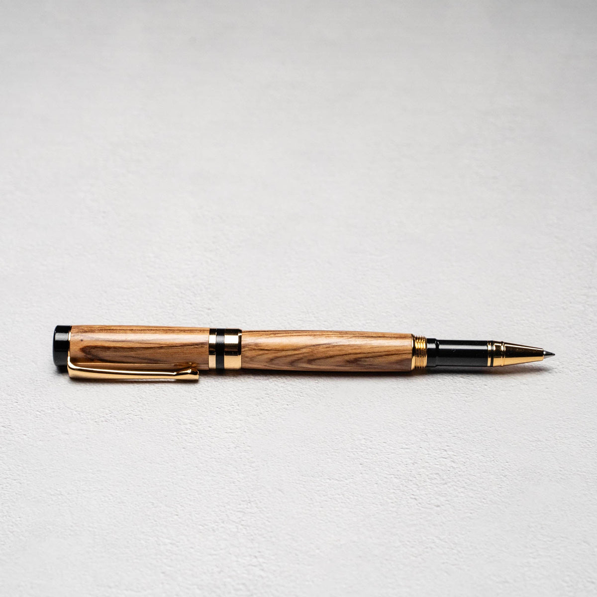 Hand - Turned Olive Wood Rollerball Pen + Fine Leather Pen Sleeve - Holtz Leather