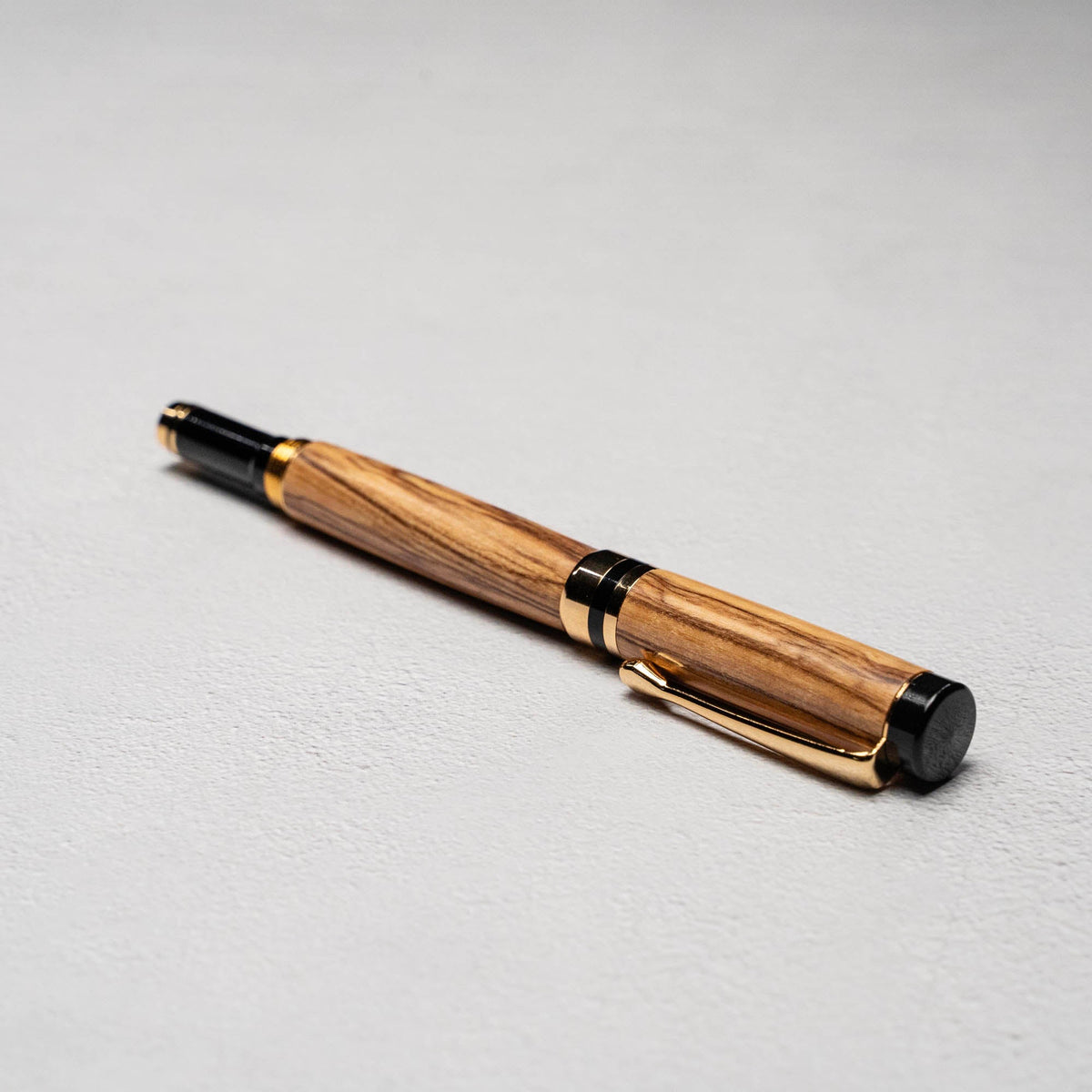Hand - Turned Olive Wood Rollerball Pen + Fine Leather Pen Sleeve - Holtz Leather