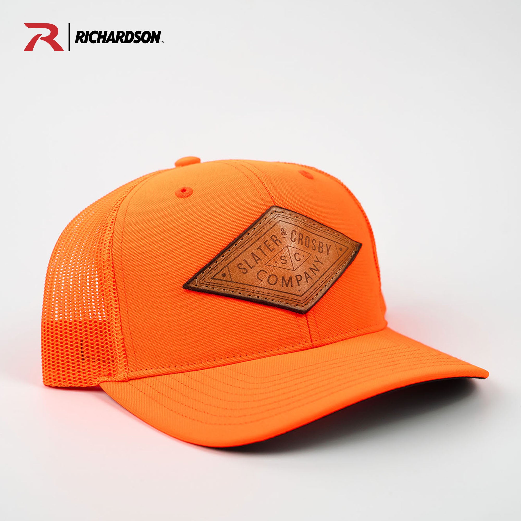Neon orange Richardson 882 trucker hat with customized leather patch from Holtz Leather Co in Huntsville, Alabama