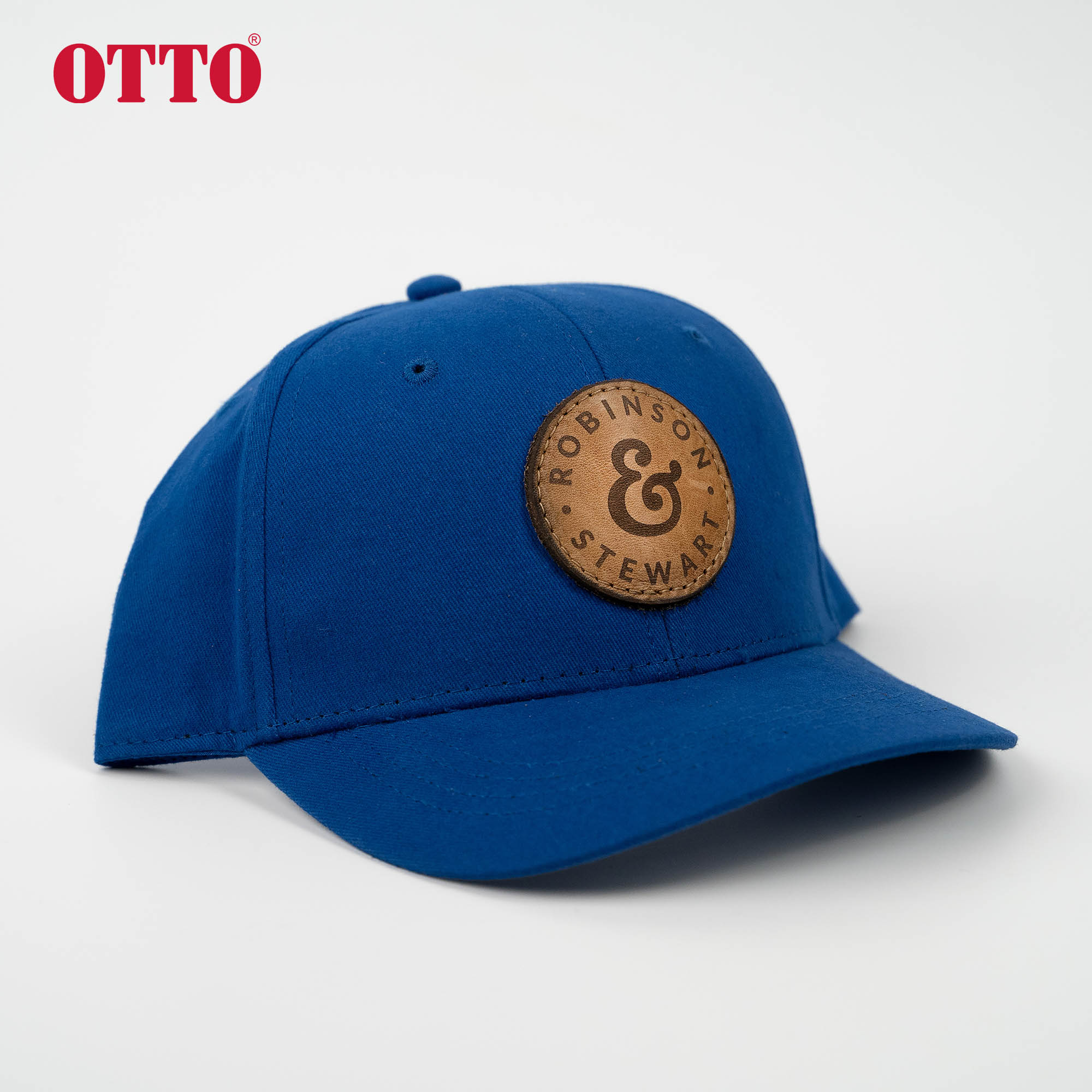 Blue OTTO youth 6 panel baseball cap with a custom leather patch