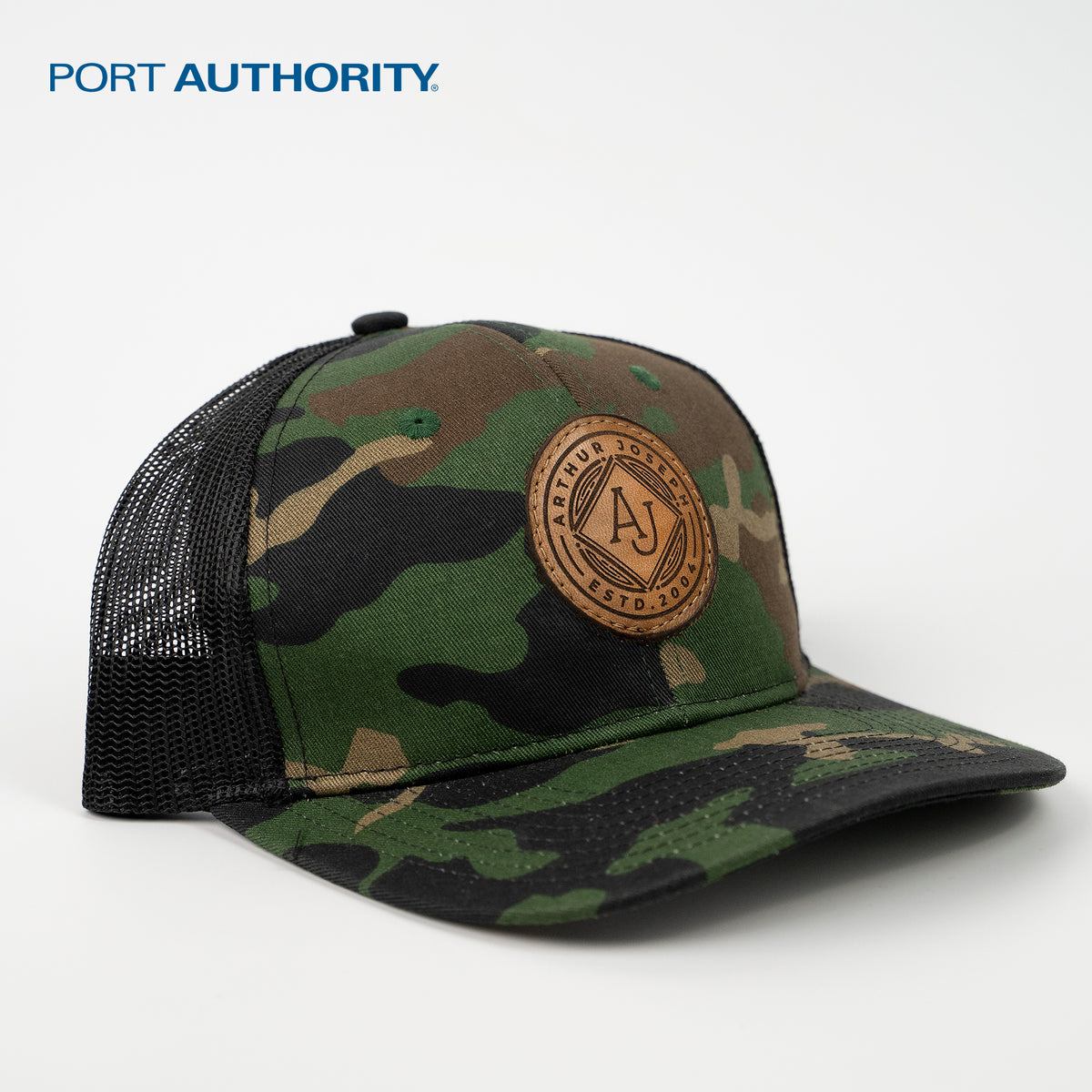 Camoflauge Port Authority C112 trucker hat with custom leather patch