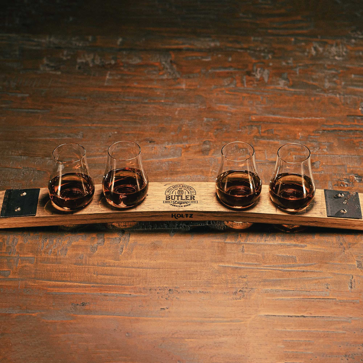 Whiskey flight made of Tennessee Whiskey barrel stave with a personalized logo
