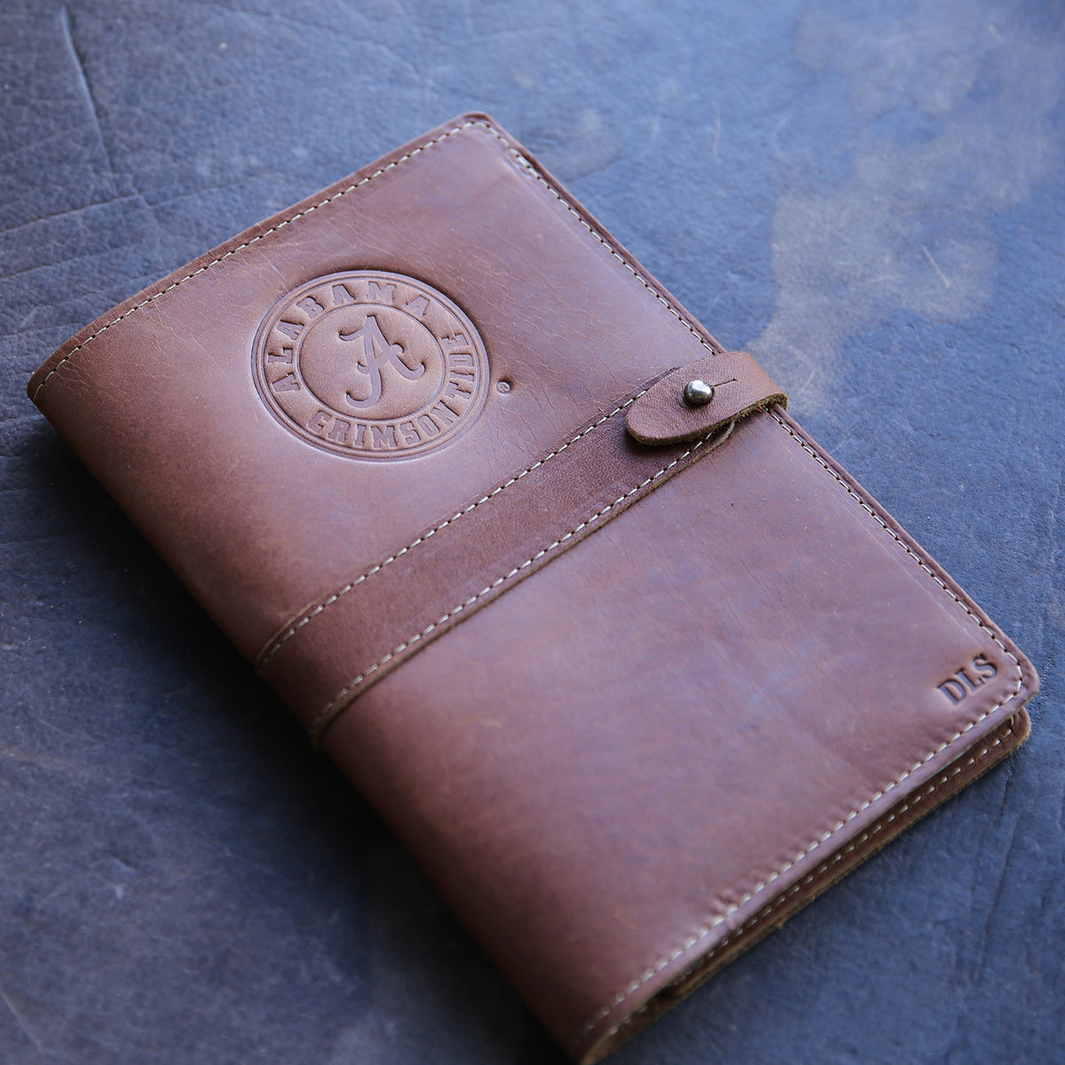 Leather journal with Alabama Crimson Tide logo and personalized initials from Holtz Leather Co in Huntsville, Alabama