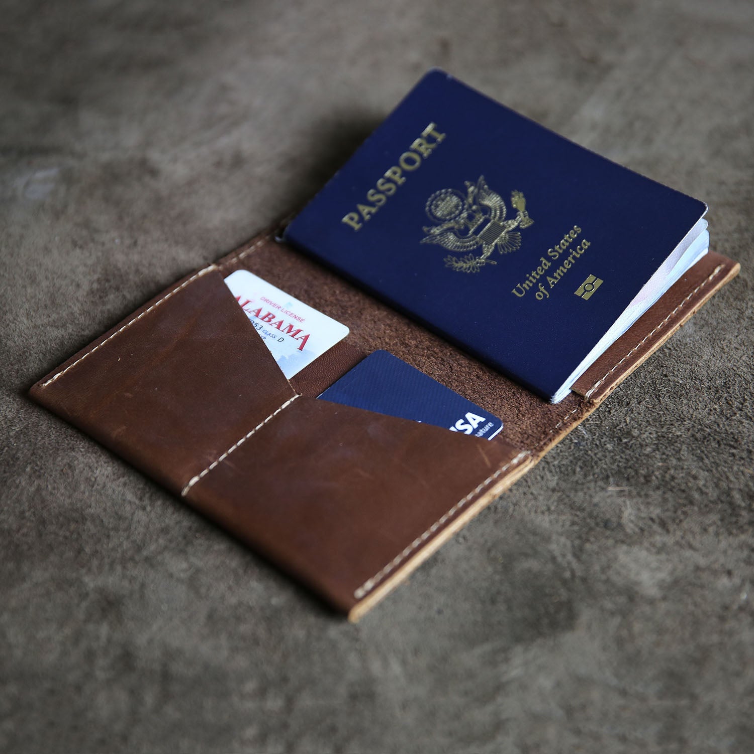 Fine American leather passport cover and wallet with a customized logo on the front