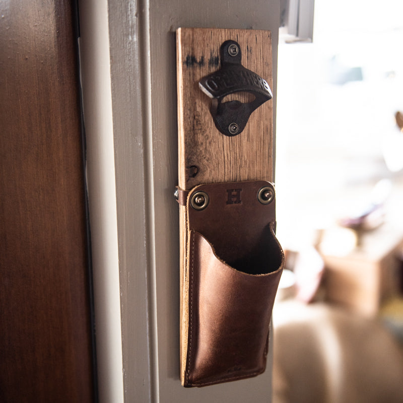 The Cooter Brown Personalized Whiskey Barrel Bottle Opener with detachable leather cap catch pouch