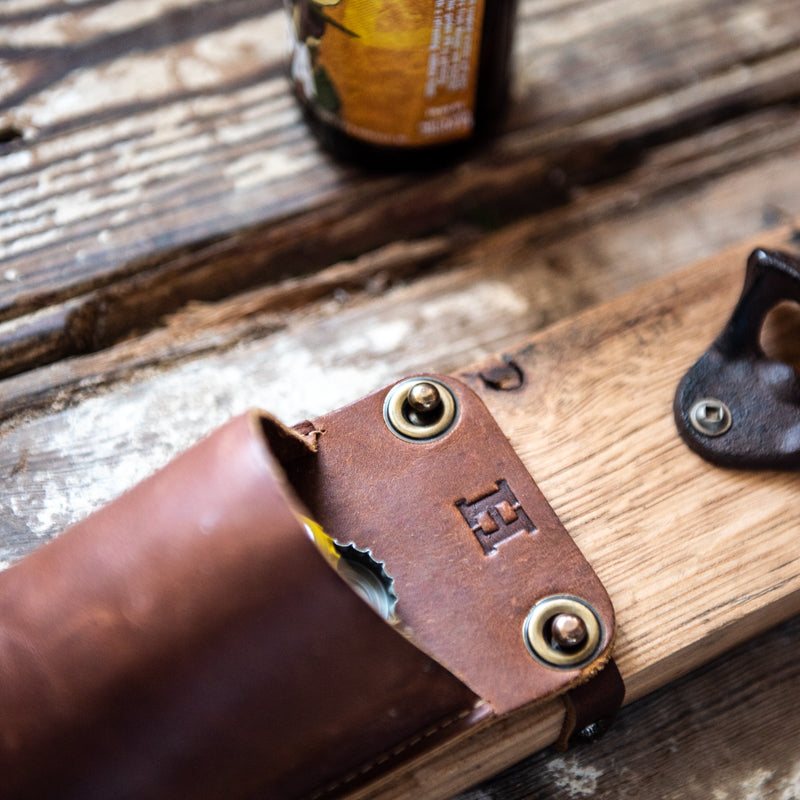 The Cooter Brown Personalized Whiskey Barrel Bottle Opener with detachable leather cap catch pouch