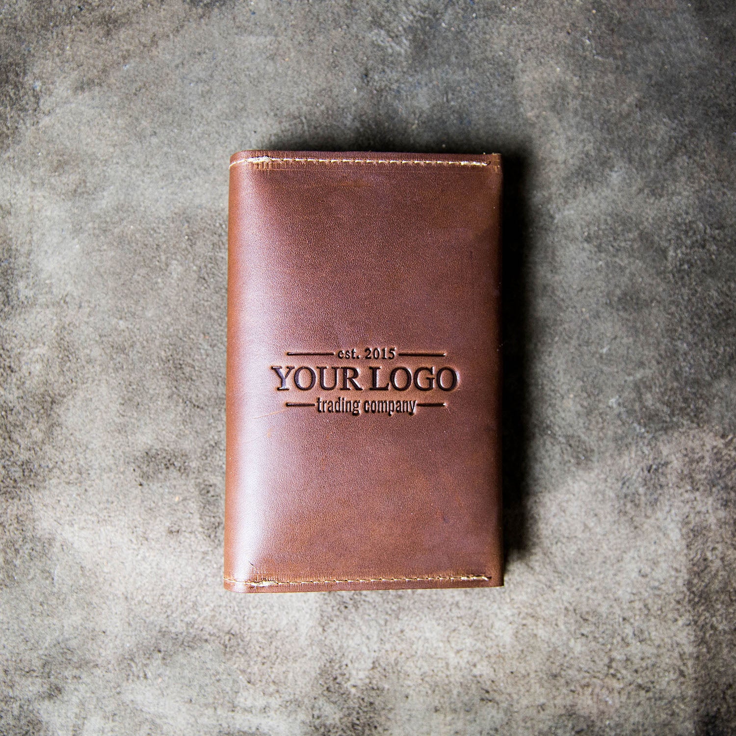 Fine American leather passport cover and wallet with a customized logo on the front