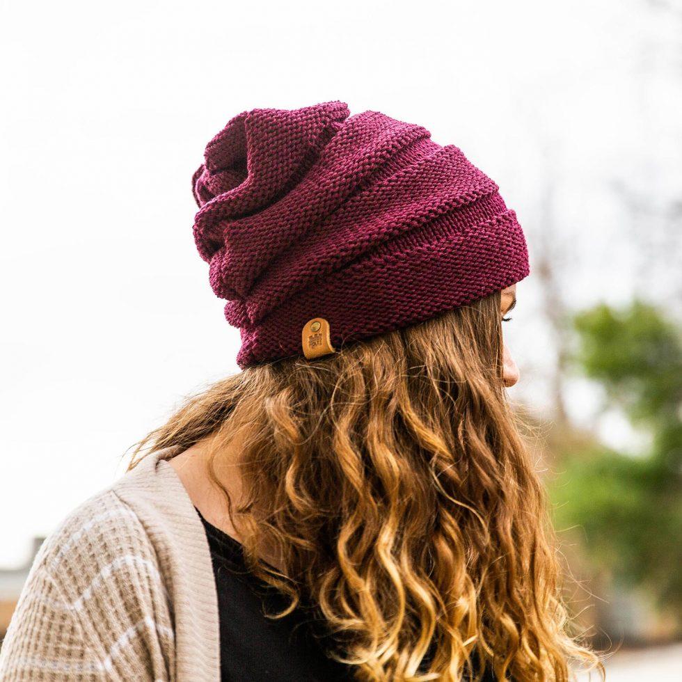 Person wearing Richardson 145 slouchy beanie with custom logo leather patch