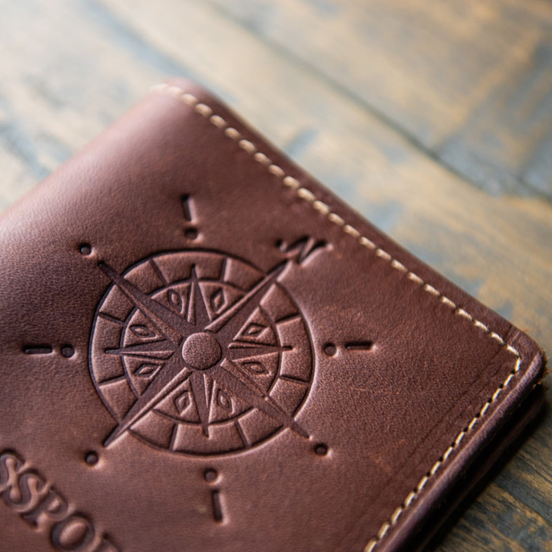 Compass imprinted on front of fine leather passport cover