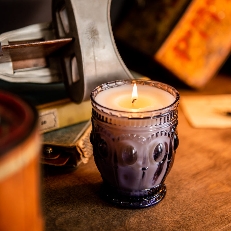 Lavender scented candle in purple vintage glass jar, hand-poured by Holtz Leather Co in Huntsville, Alabama