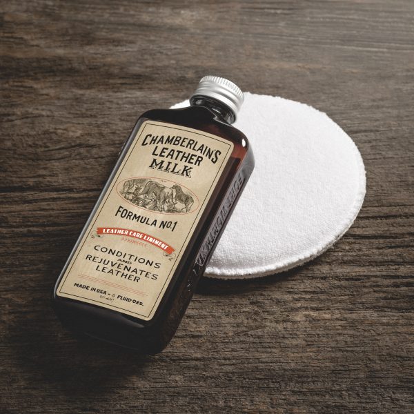 Chamberlain's leather milk formula No. 1 leather care liniment in bottle with cleaning pad