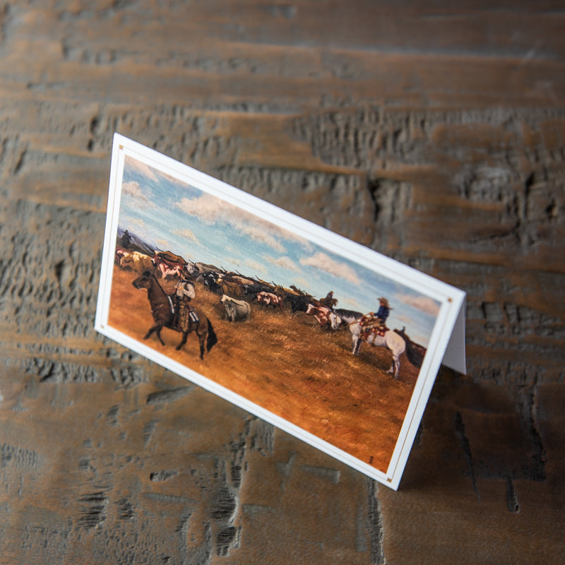Stationery card with painting of cowboys herding cows.