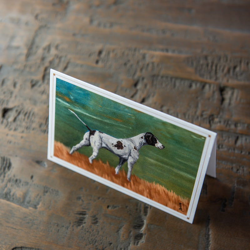 Card stationery with painting of a black hound dog in a field