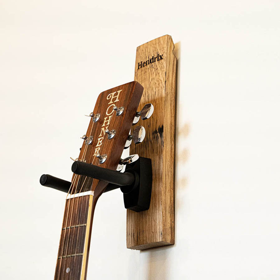 Guitar holder made of Tennessee Whiskey Barrel with personalized name and handcrafted at Holtz Leather Co