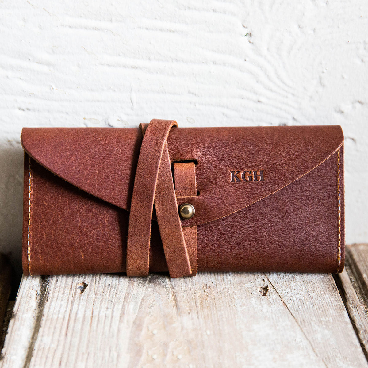 Fine leather pocketbook and checkbook with personalized initials and wrap closure from Holtz Leather Co in Huntsville, Alabama