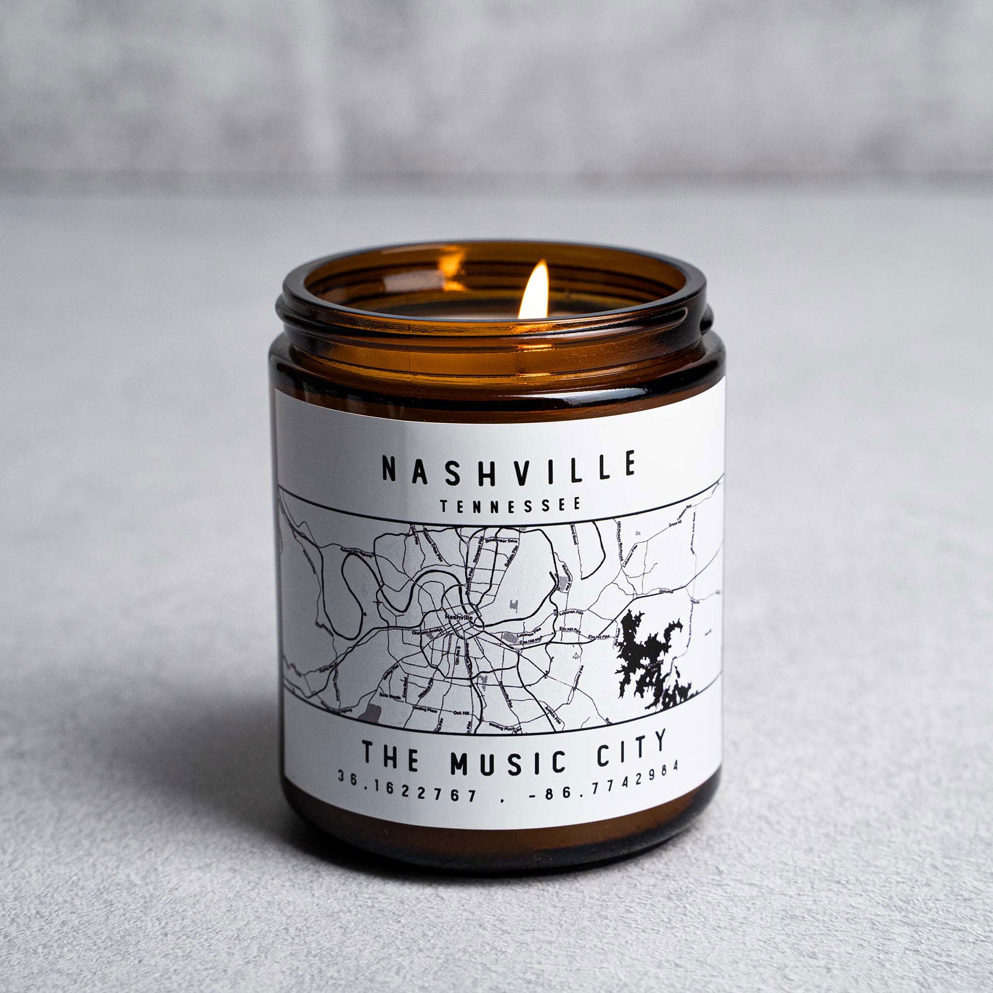Candle in amber glass jar with Nashville, Tennessee The Music City map and coordinates