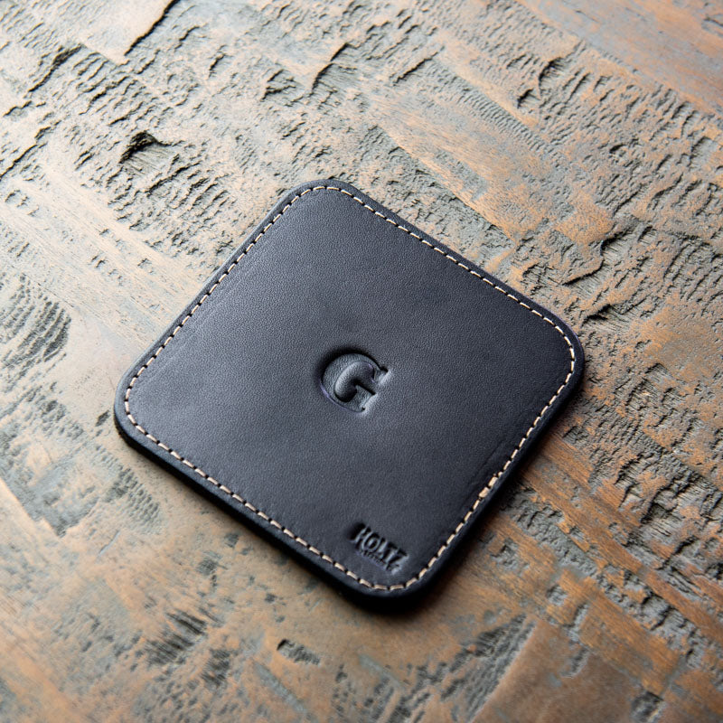 Full-grain single-stitch American leather personalized leather coasters. Available in dark brown, black, and chestnut. leather.  