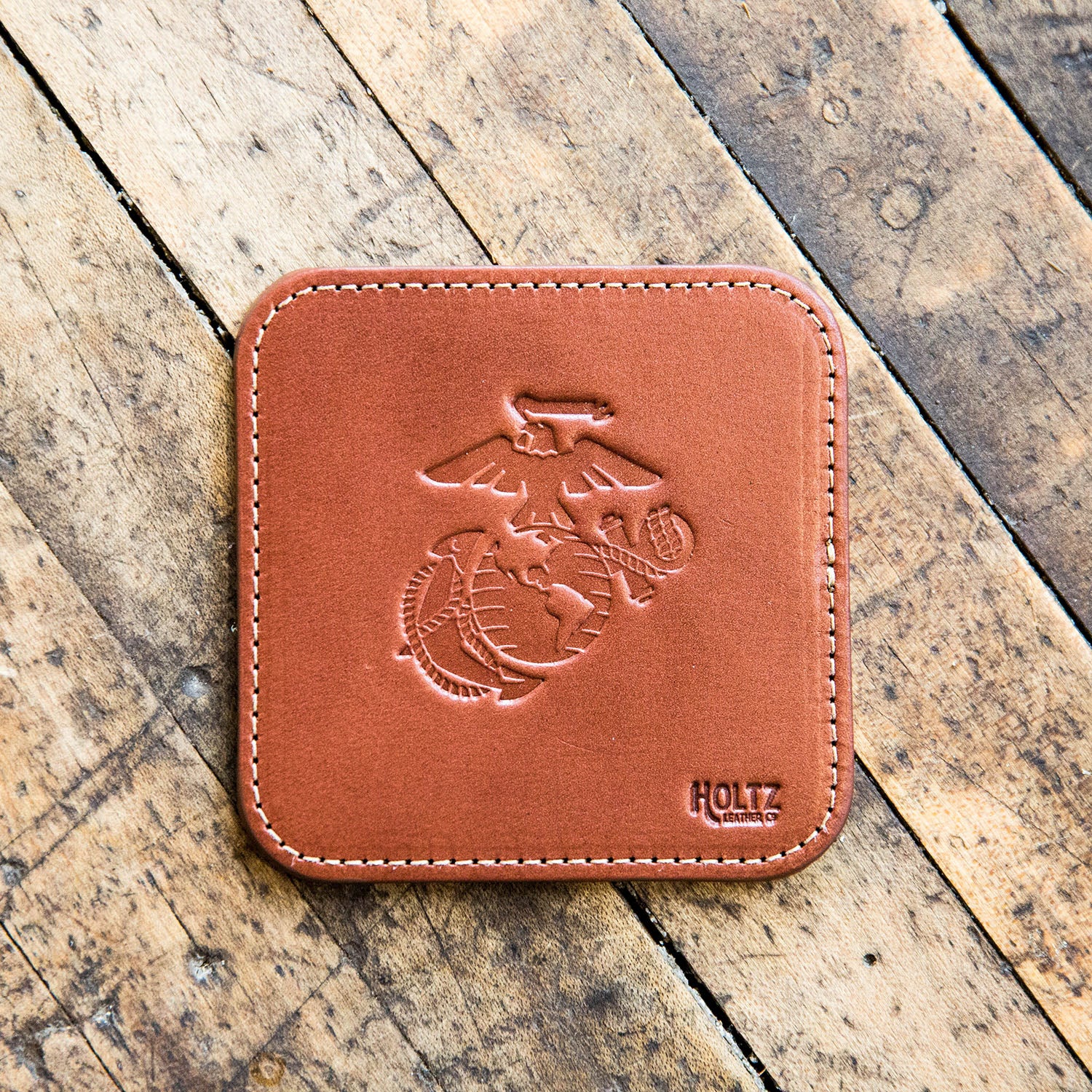 Fine leather coaster with Marine Corps logo and Holtz Leather Co logo