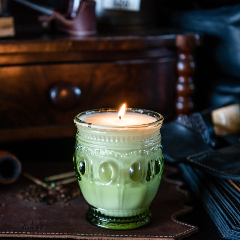 Tobacco and bay leaf scented candle in light green vintage style glass jar, hand-poured by Holtz Leather Co in Huntsville, Alabama