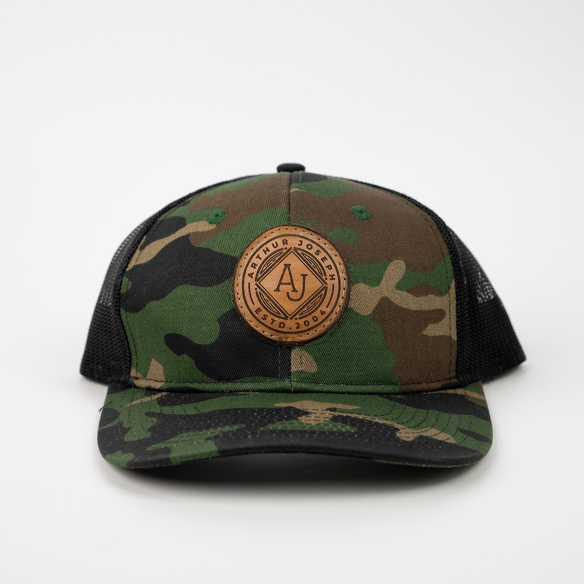 Camoflauge Port Authority C112 trucker hat with custom leather patch