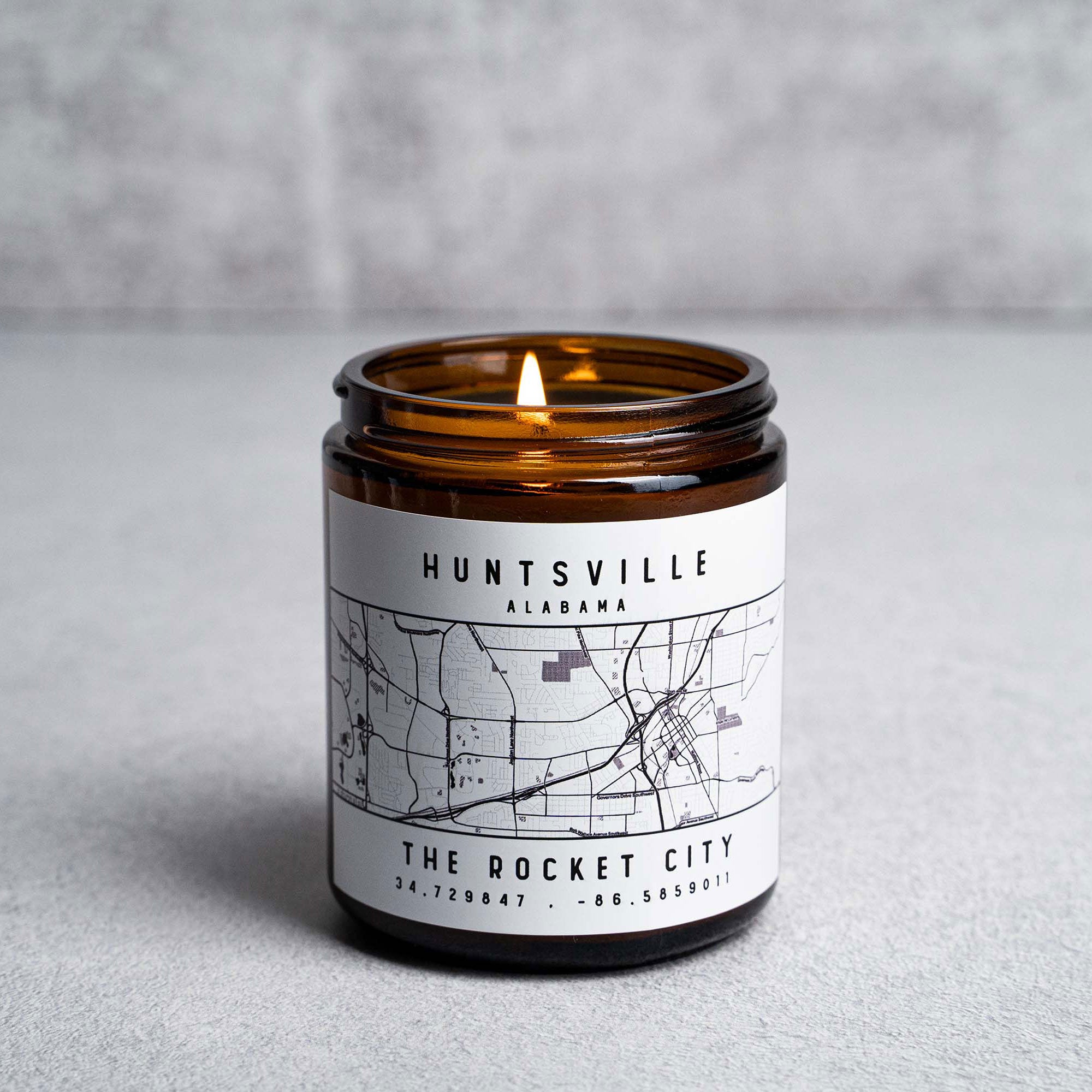 Candle in amber jar with Huntsville, Alabama The Rocket City map and coordinates, hand-poured at Holtz Leather Co in Huntsville, Alabama